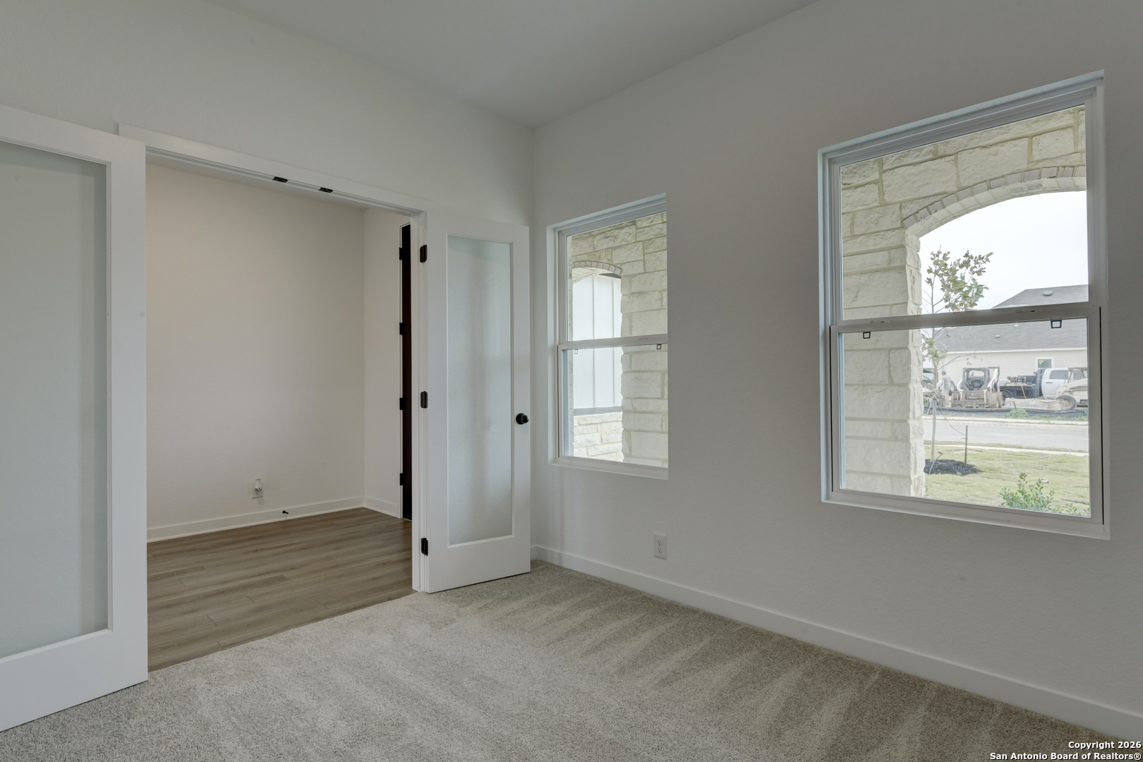 12848 Red Apple Road Schertz, TX 78154 - Photo 6 of 37 an empty room with windows and closet