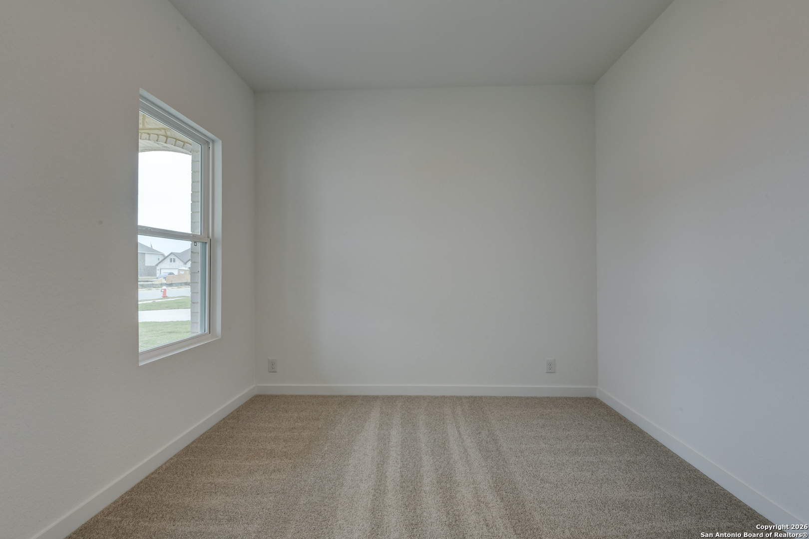 12848 Red Apple Road Schertz, TX 78154 - Photo 7 of 37 an empty room with a window