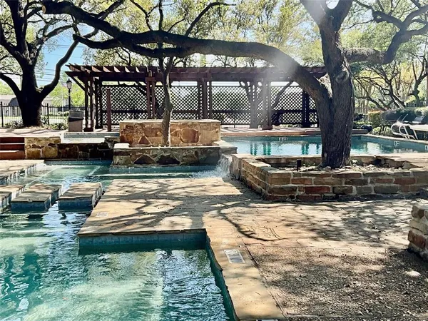 a view of a swimming pool with a patio
