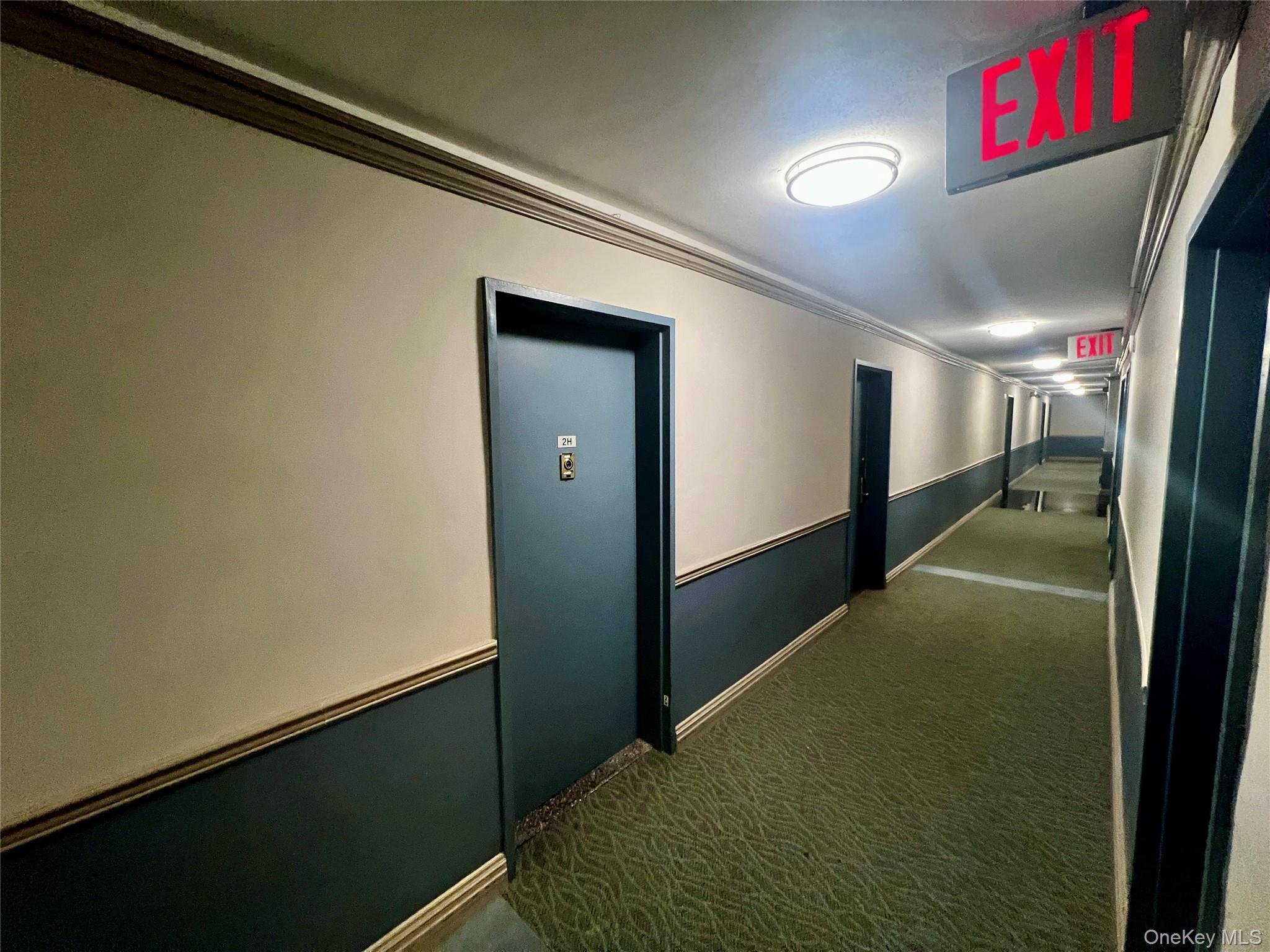 84-29 155th Avenue, Unit 2H Queens, NY 11414 - Photo 30 of 38 Hall featuring crown molding and carpet