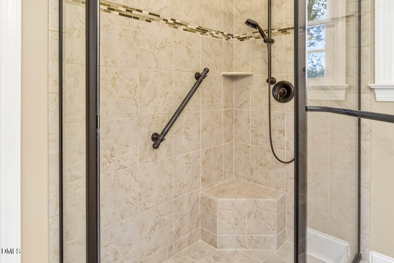 2209 Lodestar Drive Raleigh, NC 27615 - Photo 17 of 50 a bathroom with a shower