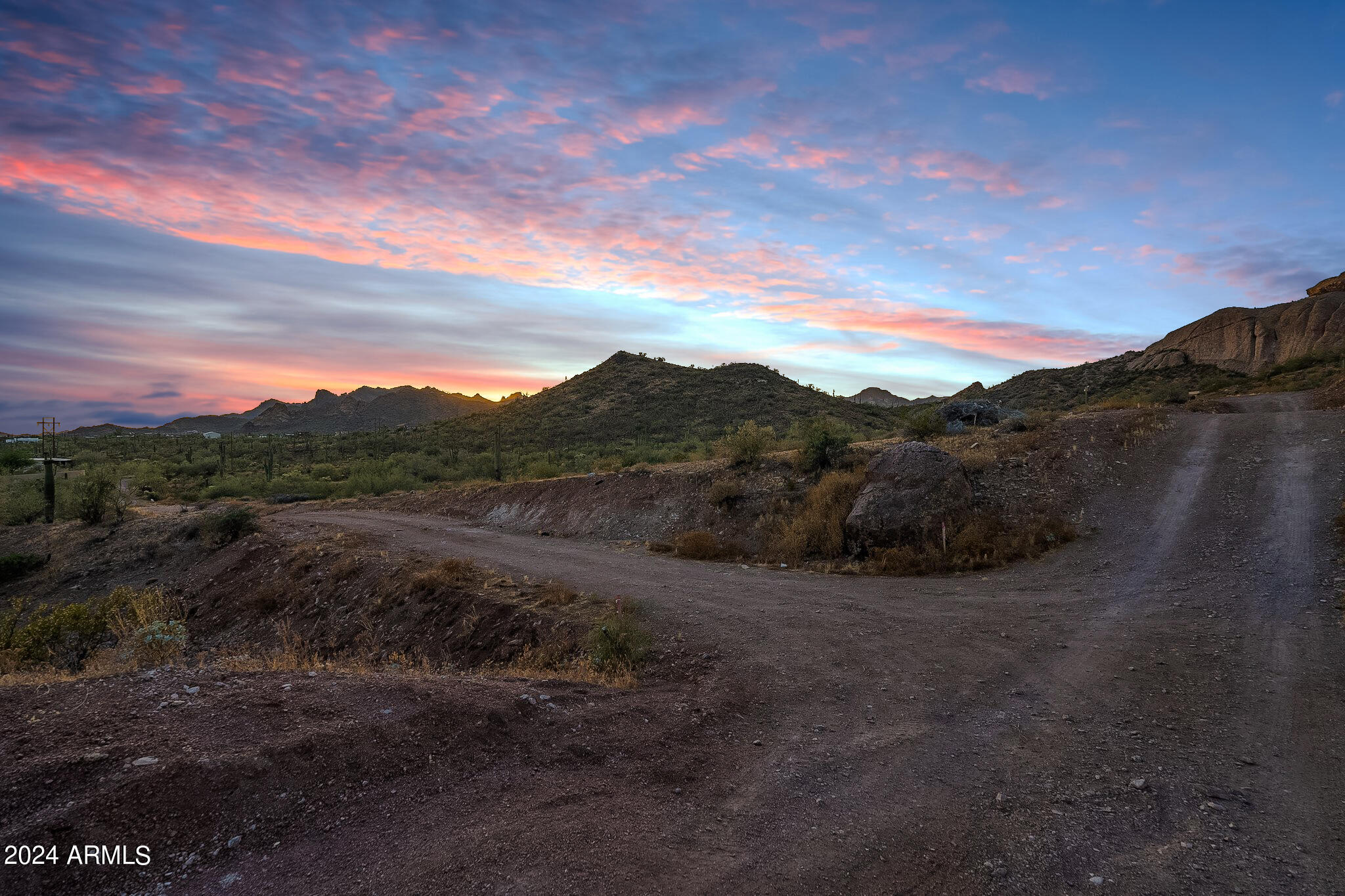 0 North Cortez Road, Unit LOT 1 Apache Junction, AZ 85119 - Photo 7 of 27 a view of a dry yard with mountains in the background