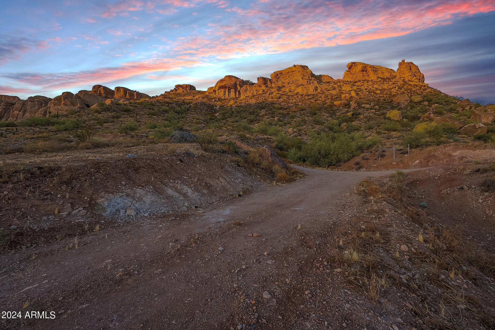 0 North Cortez Road, Unit LOT 1 Apache Junction, AZ 85119 - Photo 8 of 27 a view of a yard with mountains in the background
