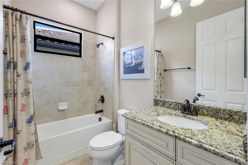 12832 Kinross Lane Naples, FL 34120 - Photo 17 of 45 Full bath featuring vanity and shower / bath combination with curtain