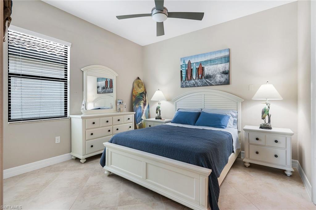 12832 Kinross Lane Naples, FL 34120 - Photo 18 of 45 Bedroom featuring ceiling fan and light tile patterned floors
