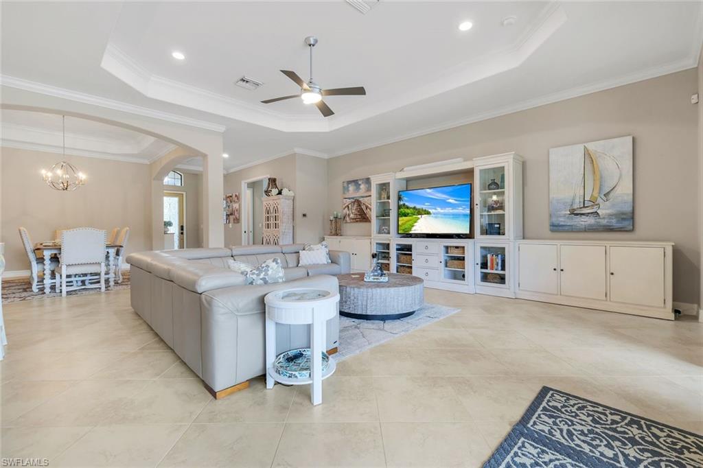 12832 Kinross Lane Naples, FL 34120 - Photo 4 of 45 Living area with a raised ceiling, ceiling fan, recessed lighting, ornamental molding, and light tile patterned flooring