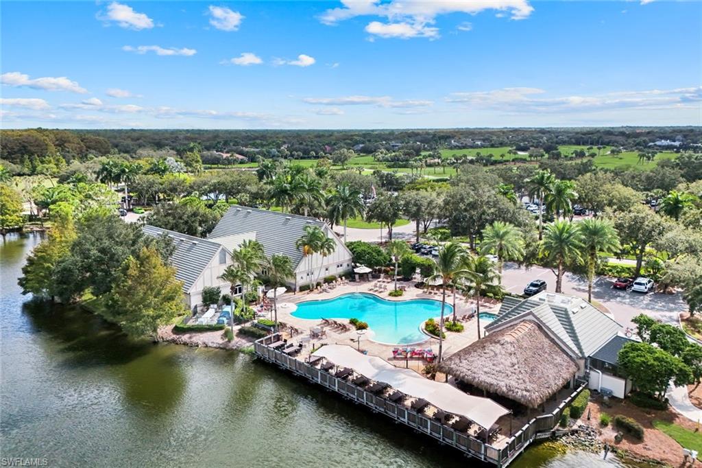 12832 Kinross Lane Naples, FL 34120 - Photo 42 of 45 Aerial view of a pool and a large body of water, and a Tiki Bar!