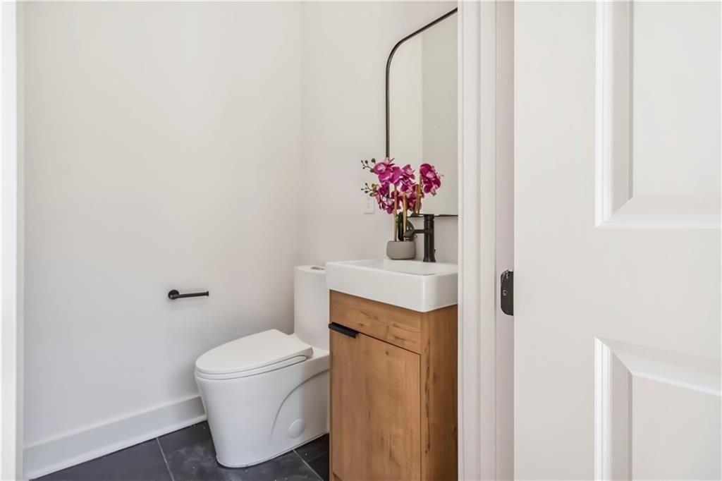 1554 Columbia Circle Decatur, GA 30032 - Photo 17 of 55 a bathroom with a sink toilet and a mirror