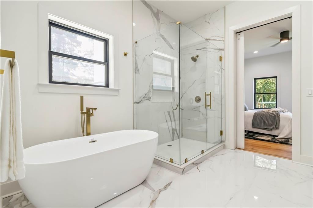 1554 Columbia Circle Decatur, GA 30032 - Photo 24 of 55 a bathroom with a tub and a shower