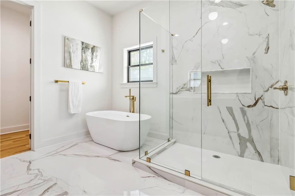1554 Columbia Circle Decatur, GA 30032 - Photo 25 of 55 a bathroom with a bathtub and a shower