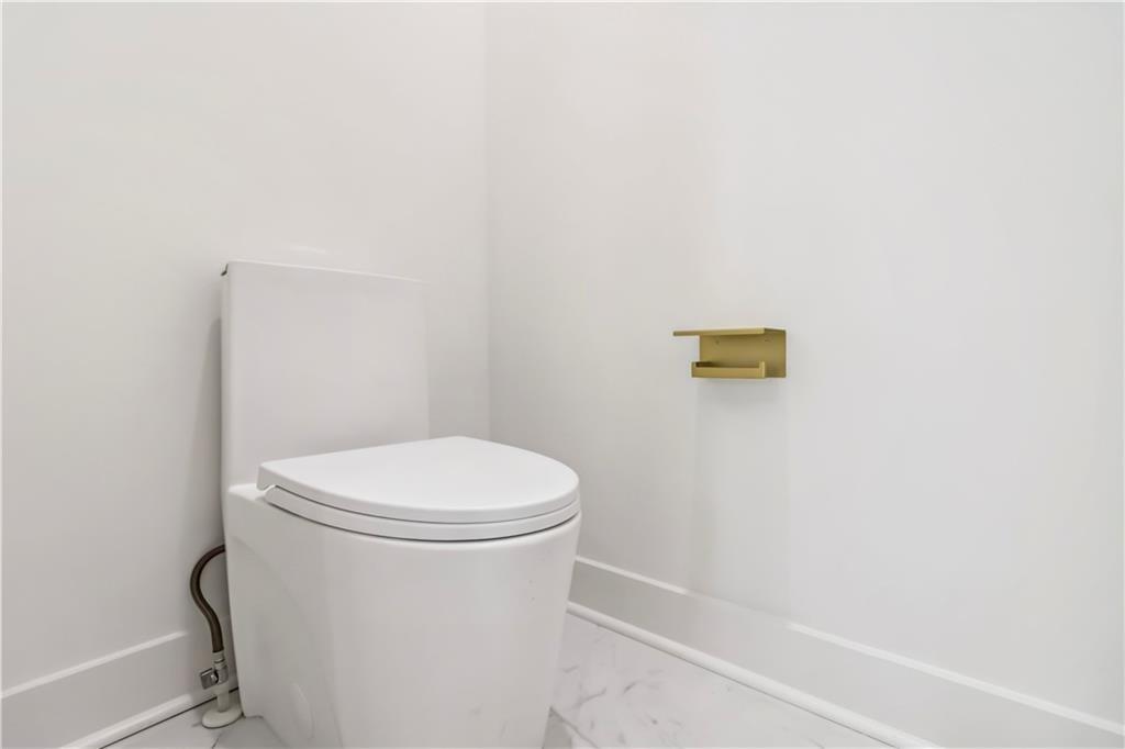 1554 Columbia Circle Decatur, GA 30032 - Photo 26 of 55 a white toilet sitting next to a shower