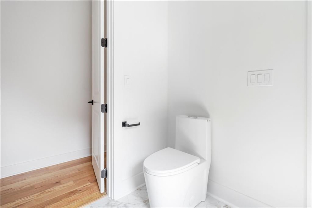 1554 Columbia Circle Decatur, GA 30032 - Photo 40 of 55 a white toilet sitting next to a shower