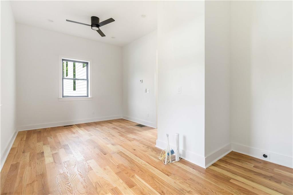 1554 Columbia Circle Decatur, GA 30032 - Photo 48 of 55 a view of empty room with wooden floor and fan