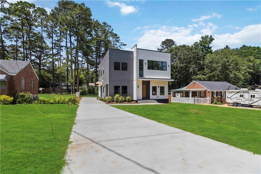 1554 Columbia Circle Decatur, GA 30032 - Photo 5 of 55 a front view of a house with a yard and trees