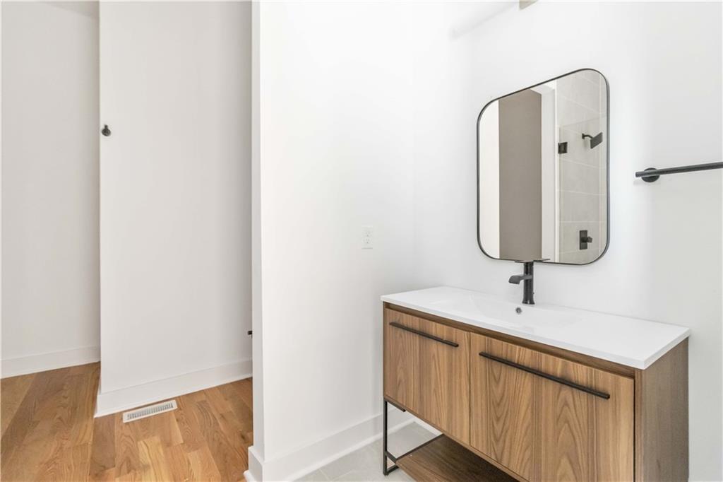 1554 Columbia Circle Decatur, GA 30032 - Photo 51 of 55 a bathroom with a sink and a mirror