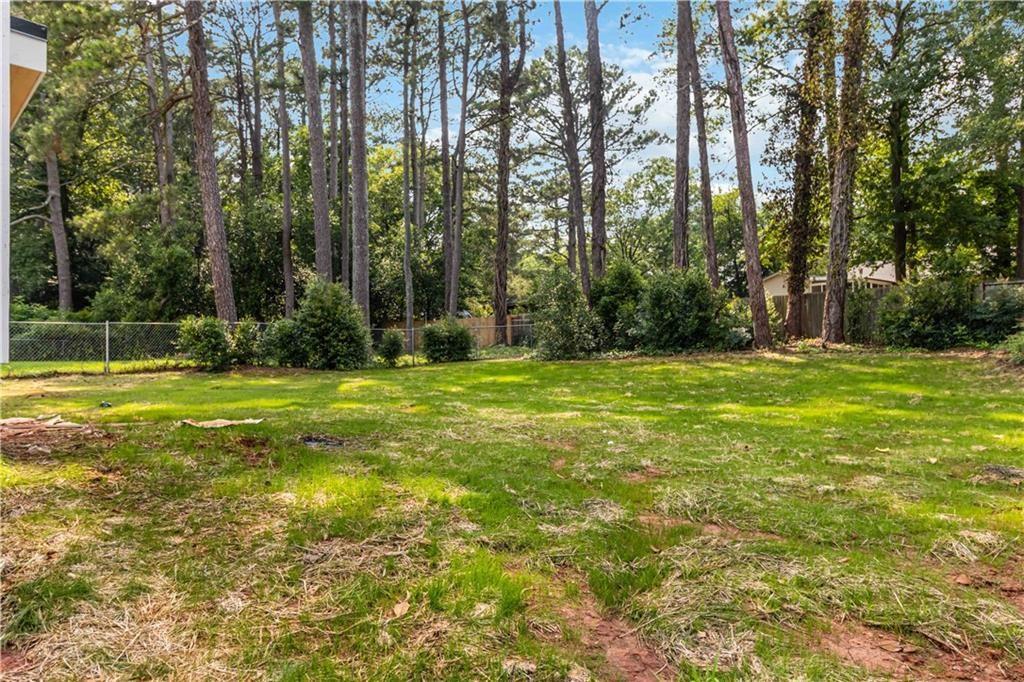 1554 Columbia Circle Decatur, GA 30032 - Photo 55 of 55 a view of a tennis ground with trees in the background