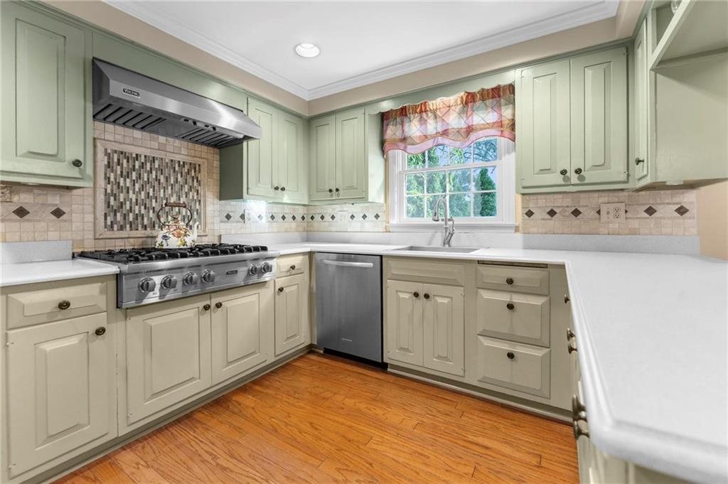 829 Ridgefield Avenue Pittsburgh, PA 15216 - Photo 12 of 50 a kitchen with white cabinets sink and window