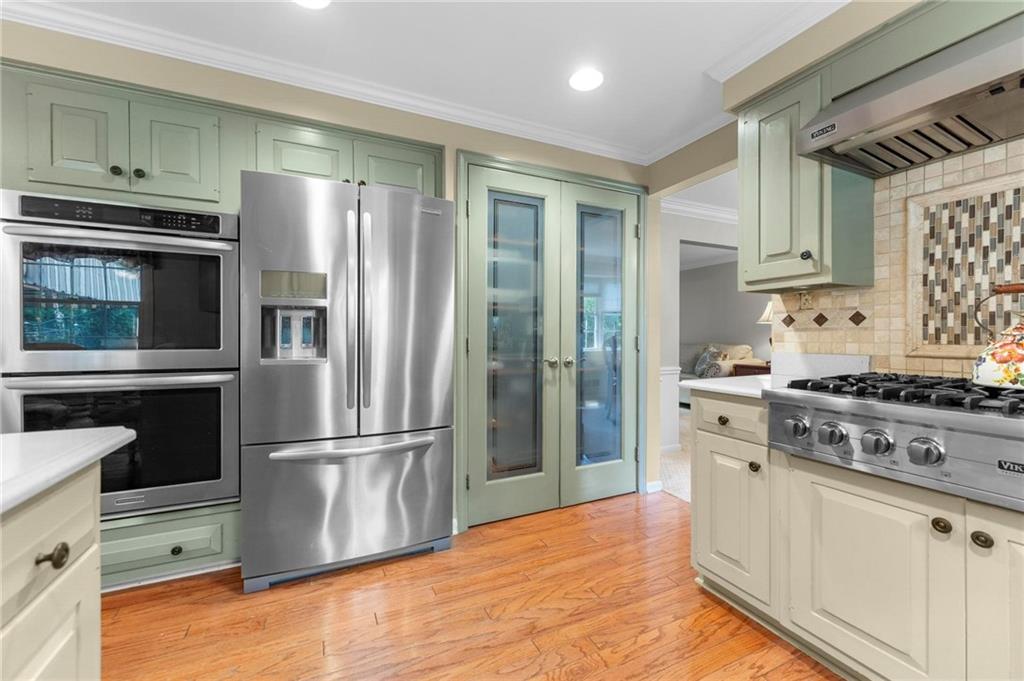 829 Ridgefield Avenue Pittsburgh, PA 15216 - Photo 13 of 50 a kitchen with granite countertop a refrigerator stove and sink