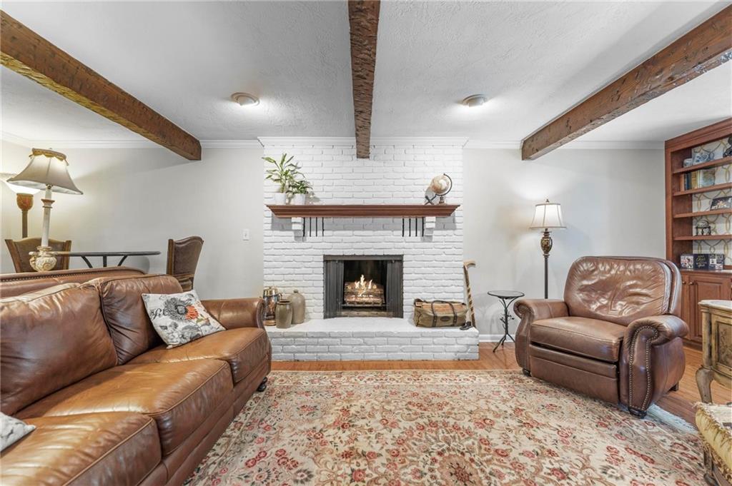 829 Ridgefield Avenue Pittsburgh, PA 15216 - Photo 19 of 50 a living room with furniture and a fireplace