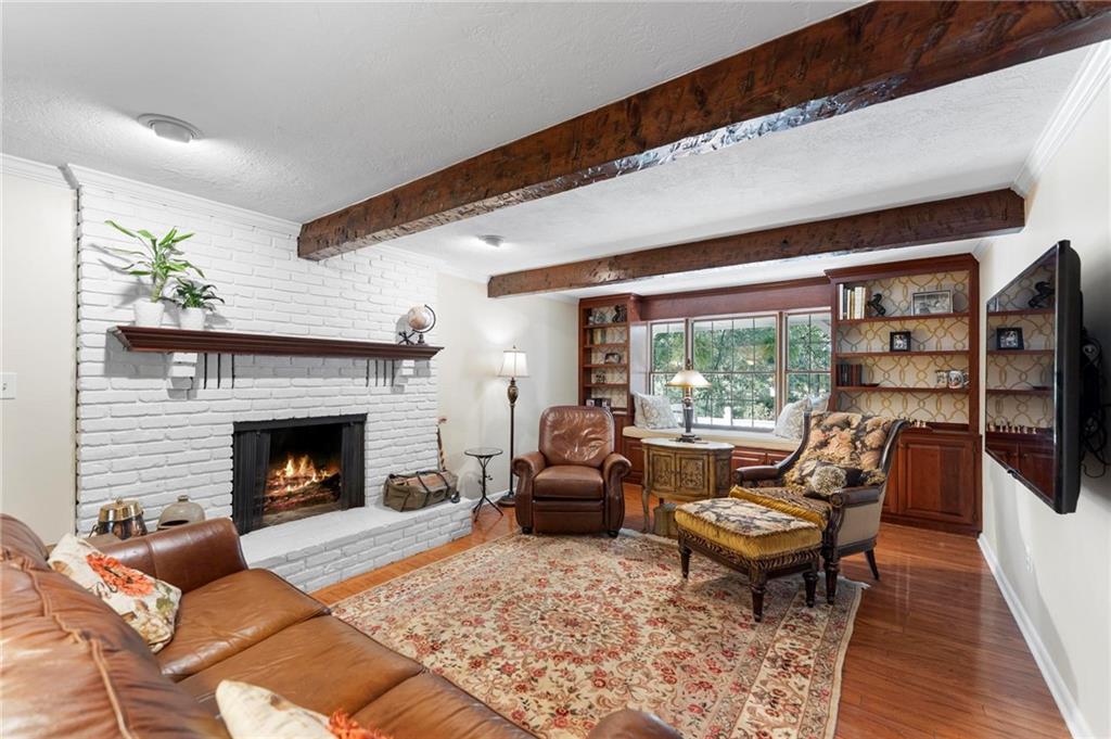 829 Ridgefield Avenue Pittsburgh, PA 15216 - Photo 22 of 50 a living room with furniture a fireplace and a large window