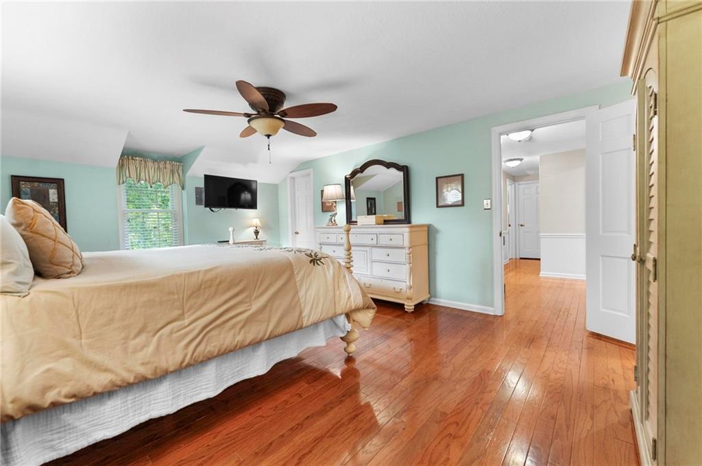 829 Ridgefield Avenue Pittsburgh, PA 15216 - Photo 27 of 50 a bedroom with a bed and wooden floor