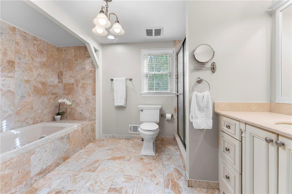 829 Ridgefield Avenue Pittsburgh, PA 15216 - Photo 28 of 50 a bathroom with a bathtub shower sink mirror and toilet