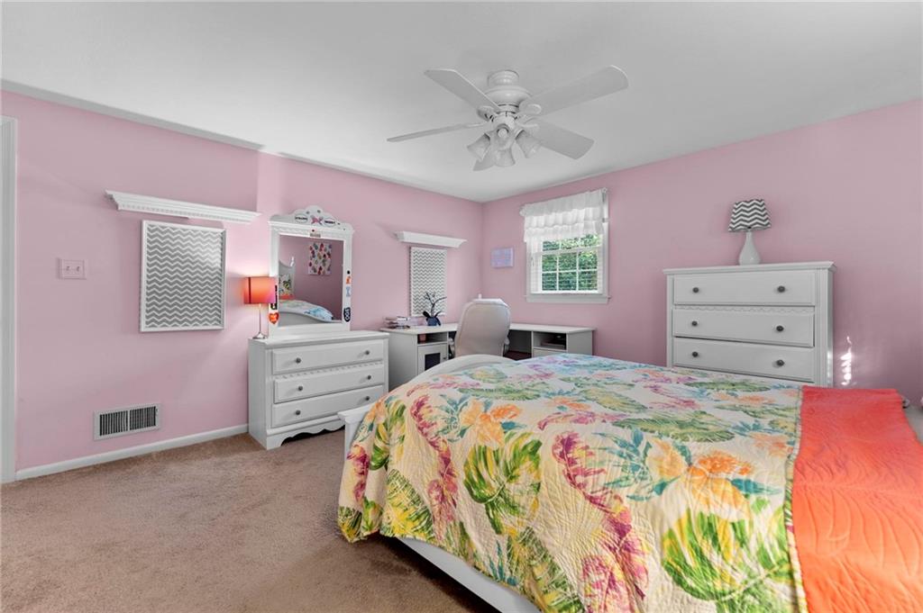 829 Ridgefield Avenue Pittsburgh, PA 15216 - Photo 31 of 50 a bedroom with a bed and a dresser