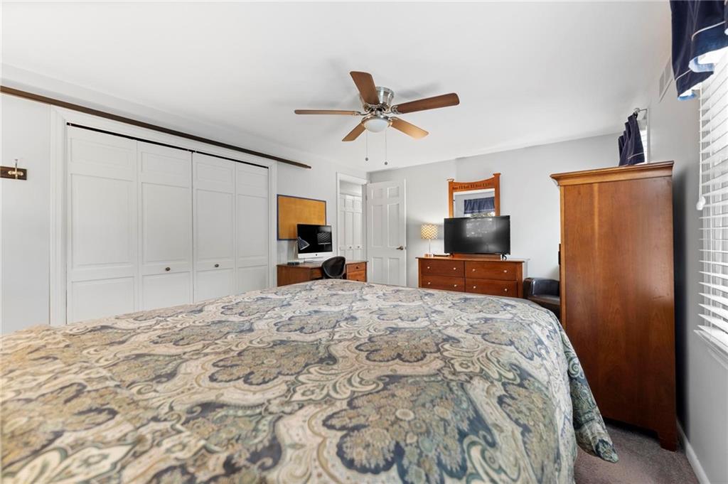 829 Ridgefield Avenue Pittsburgh, PA 15216 - Photo 33 of 50 a bedroom with a bed and a television