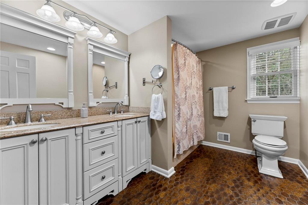 829 Ridgefield Avenue Pittsburgh, PA 15216 - Photo 37 of 50 a bathroom with a granite countertop sink toilet and shower
