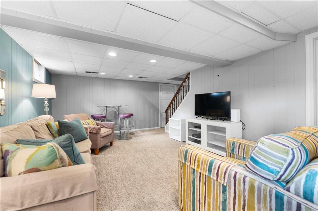 829 Ridgefield Avenue Pittsburgh, PA 15216 - Photo 39 of 50 a living room with furniture and a flat screen tv