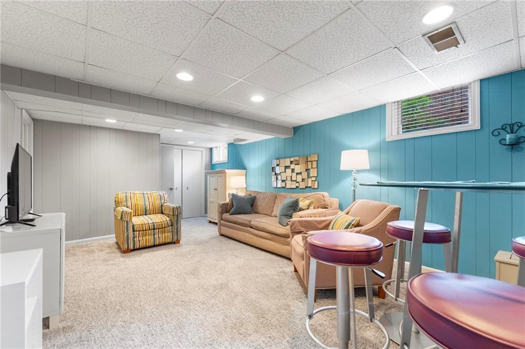 829 Ridgefield Avenue Pittsburgh, PA 15216 - Photo 41 of 50 a living room with furniture and a flat screen tv