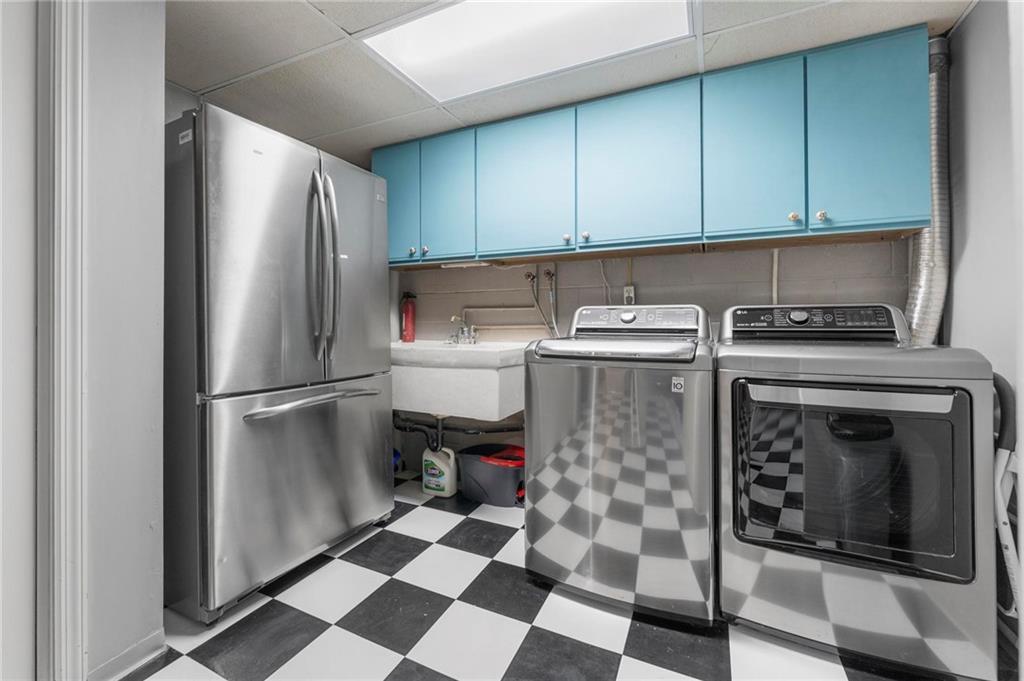 829 Ridgefield Avenue Pittsburgh, PA 15216 - Photo 43 of 50 a kitchen with a stove top oven and refrigerator