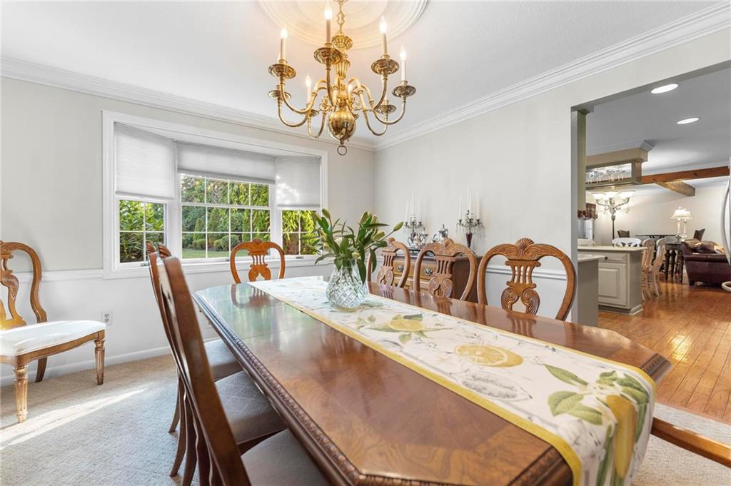829 Ridgefield Avenue Pittsburgh, PA 15216 - Photo 10 of 50 a dining room with wooden floor and large windows