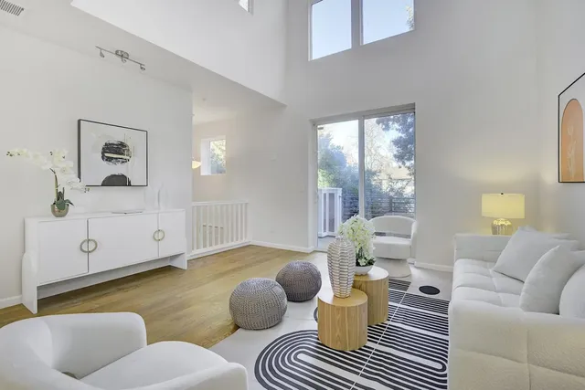 a living room with furniture and a rug