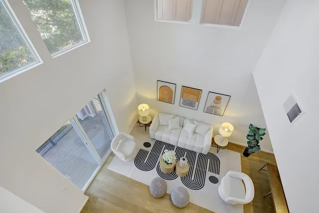 a table with chairs and a wooden floor