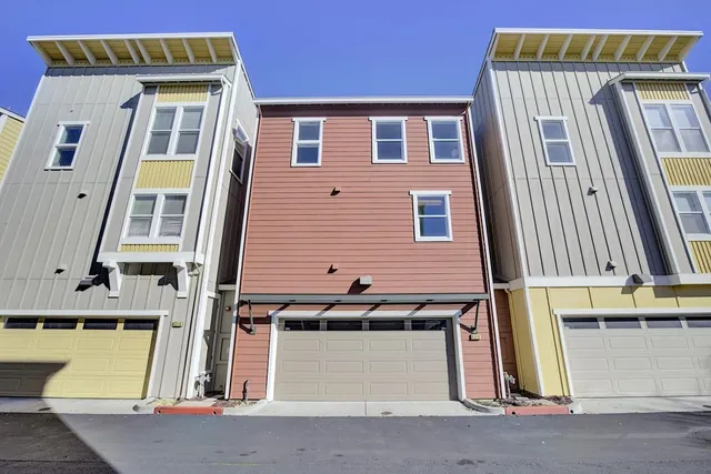 a view of a brick building with many windows