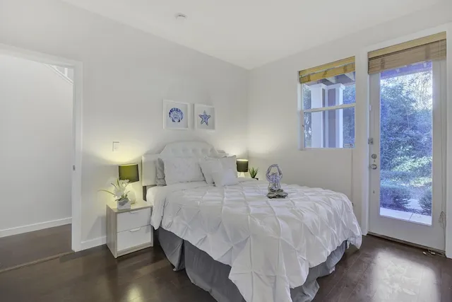 a bedroom with a bed and window