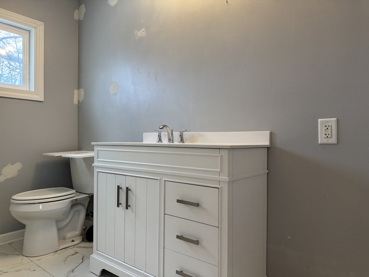 612 15th Avenue Sterling, IL 61081 - Photo 11 of 33 a bathroom with a sink toilet and a mirror
