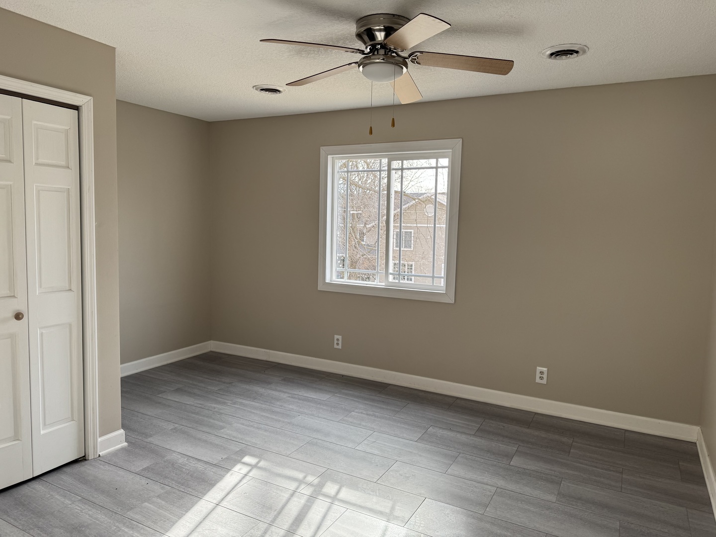 612 15th Avenue Sterling, IL 61081 - Photo 13 of 33 wooden floor in an empty room with a window