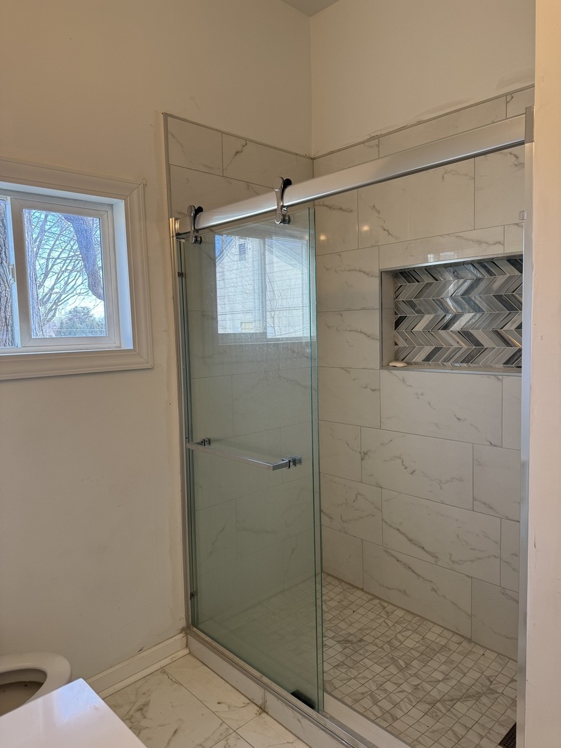 612 15th Avenue Sterling, IL 61081 - Photo 19 of 33 a bathroom with a shower