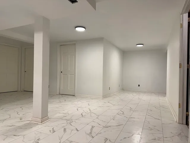 a view of a livingroom and a bathroom