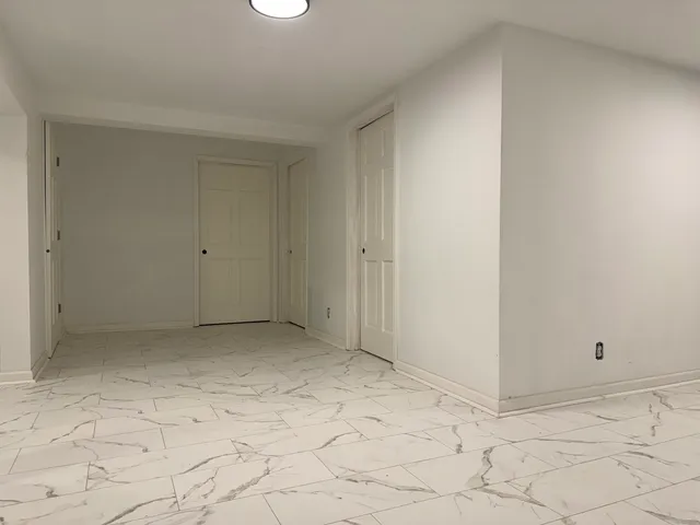 a view of a hallway to a room