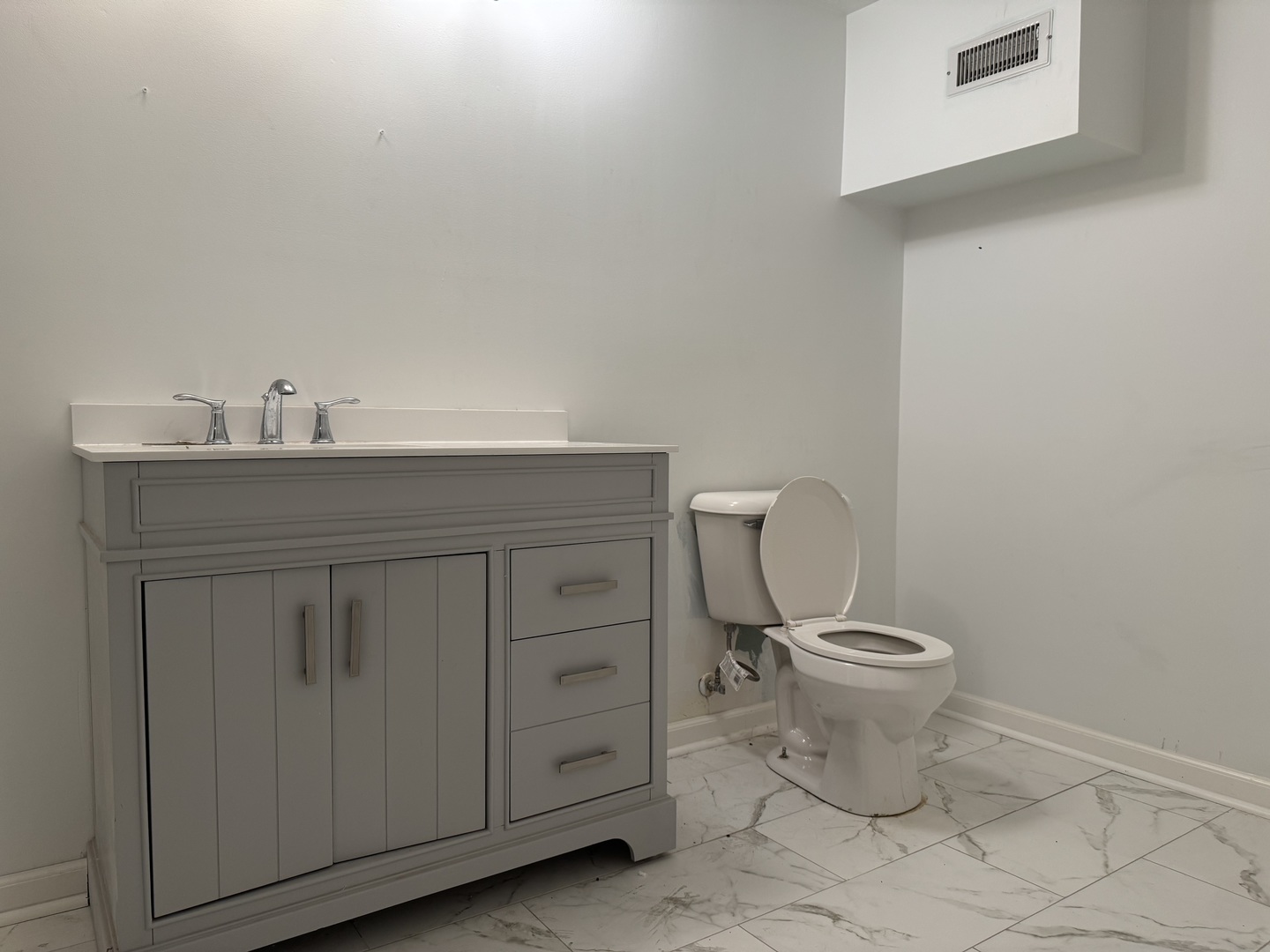 612 15th Avenue Sterling, IL 61081 - Photo 25 of 33 a bathroom with a granite countertop toilet and a sink