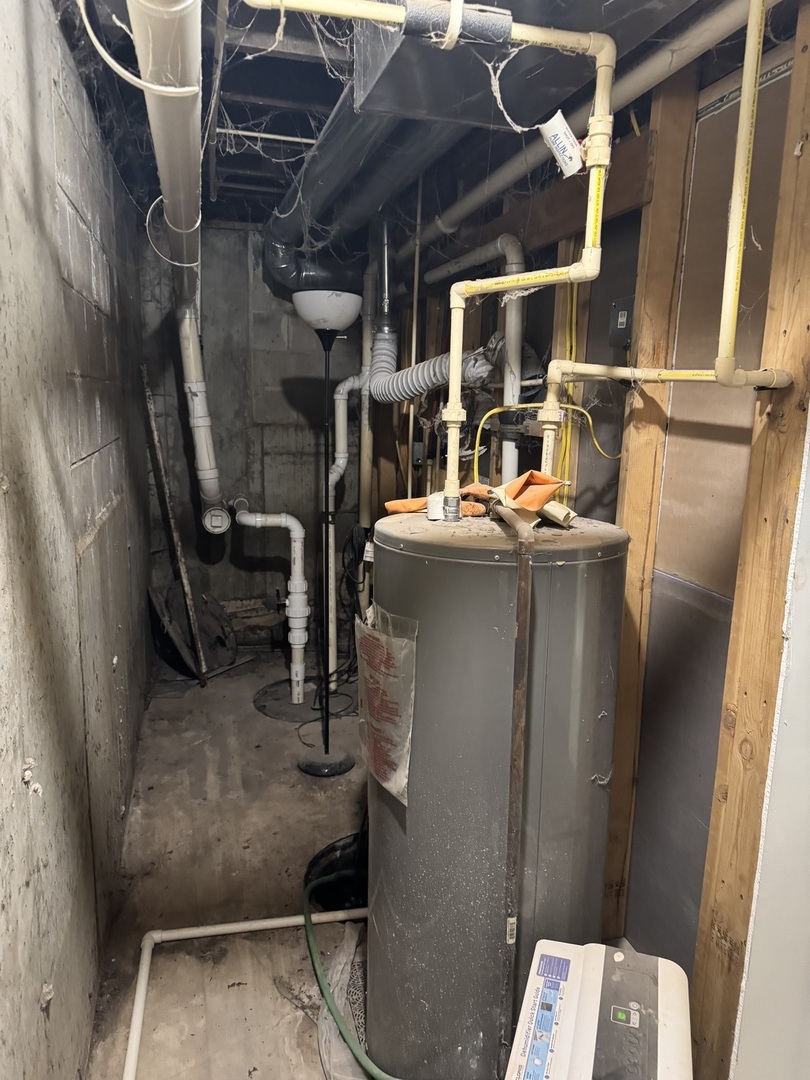 612 15th Avenue Sterling, IL 61081 - Photo 29 of 33 a room with water heater and wooden racks