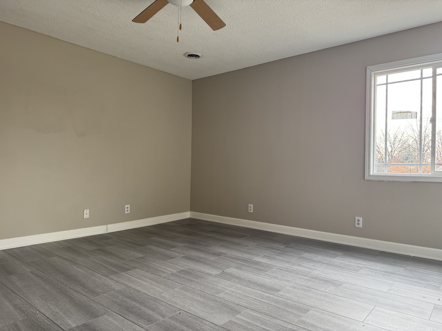 612 15th Avenue Sterling, IL 61081 - Photo 8 of 33 wooden floor in an empty room with a window