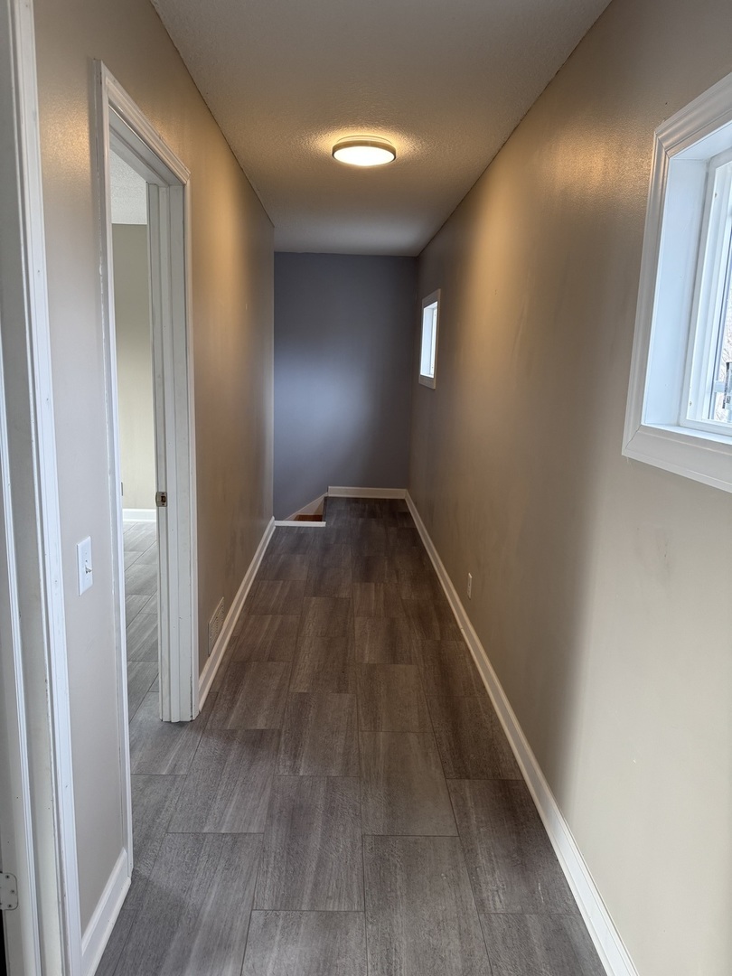 612 15th Avenue Sterling, IL 61081 - Photo 9 of 33 a view of hallway with wooden floor