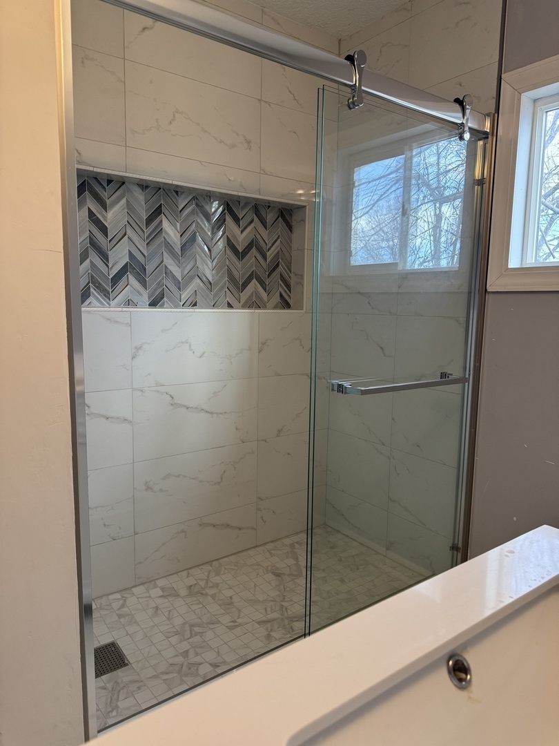 612 15th Avenue Sterling, IL 61081 - Photo 10 of 33 a bathroom with a bathtub and shower