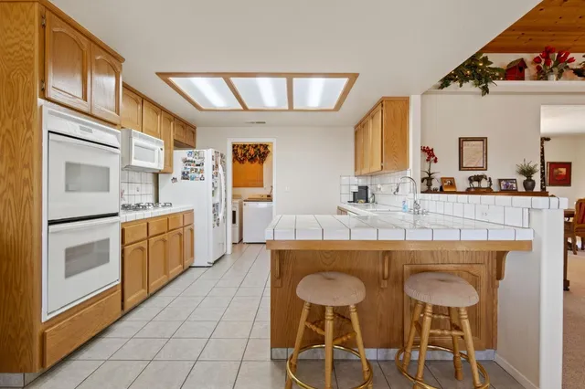 a kitchen with stainless steel appliances a sink and cabinets