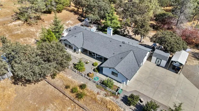 an aerial view of a house with outdoor space
