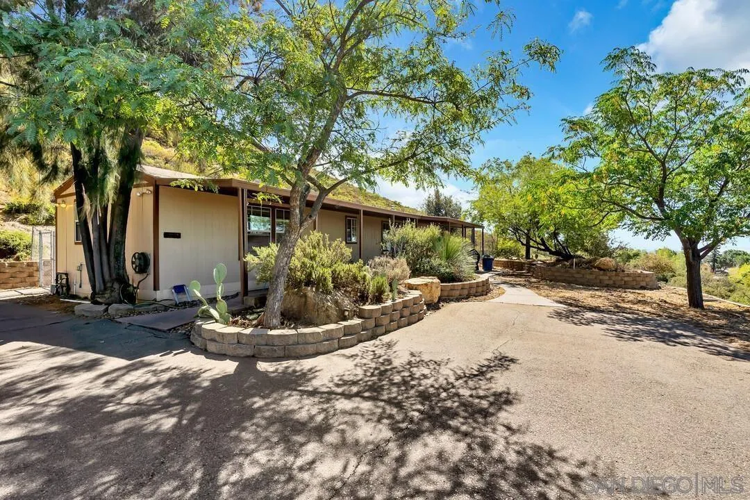 23611-13 Old Ranch Road Alpine, CA 91901 - Photo 5 of 25 a view of a house with backyard and tree